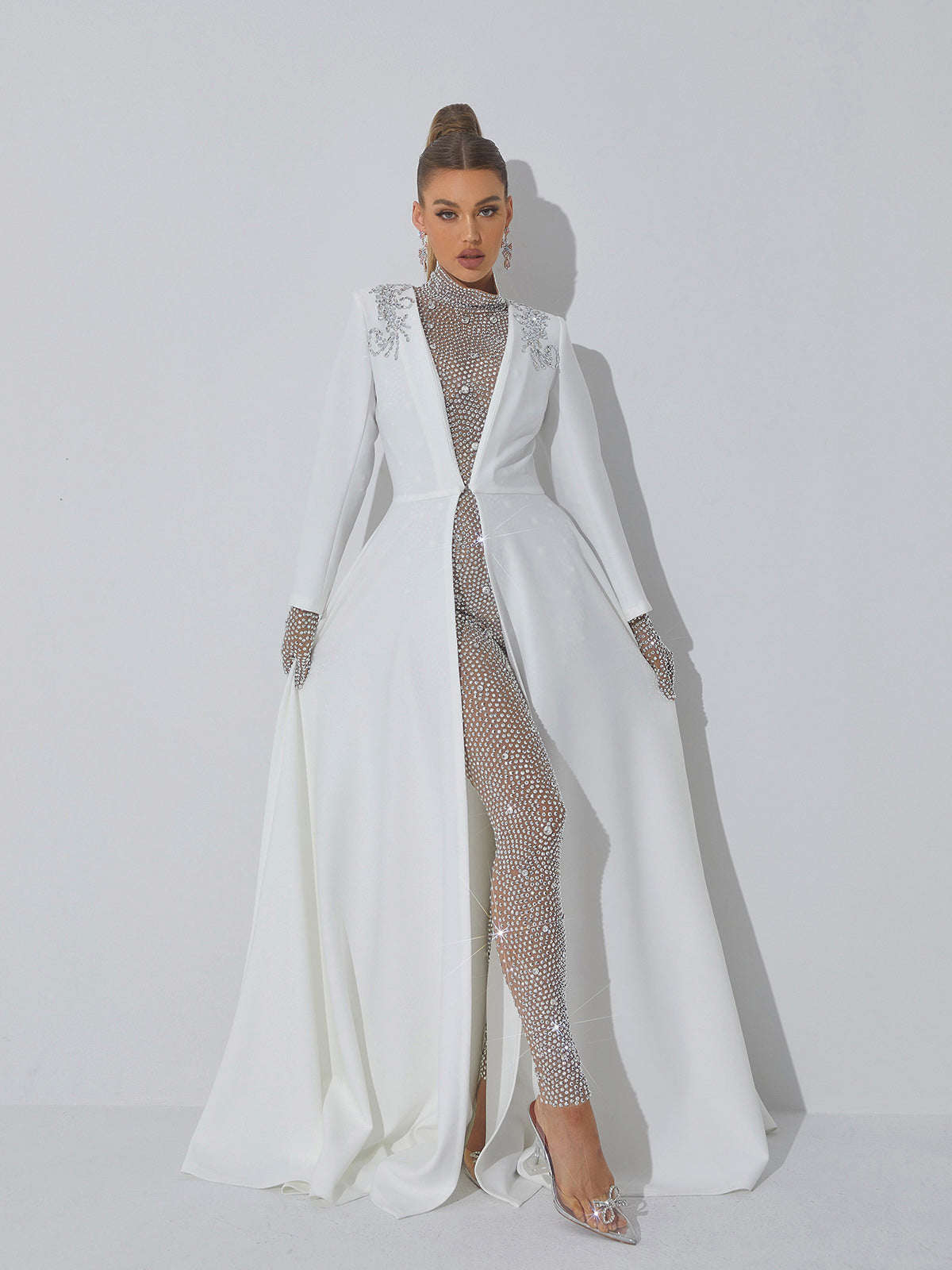 Ally Rhinestone Mesh Jumpsuit in Silver with long sleeves and rhinestone details, perfect for glamorous occasions.