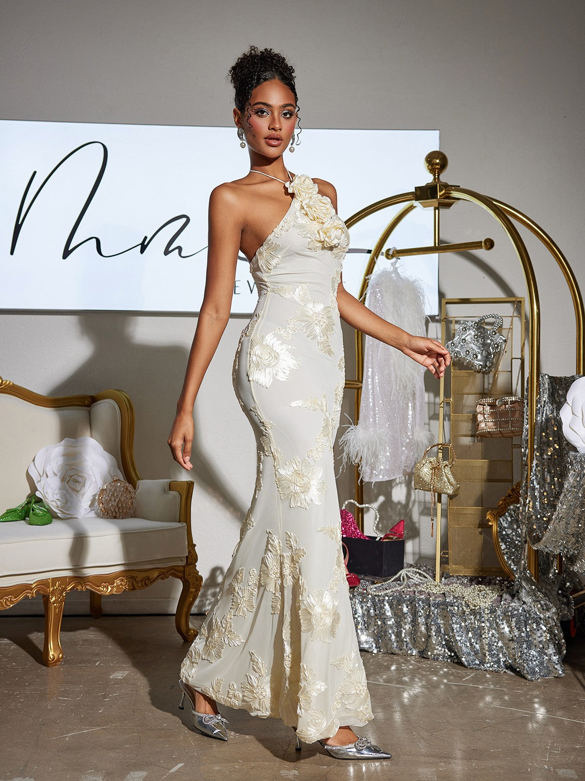 Back view of the Aedin Halterneck Flower Maxi Dress, featuring a lace-up design for a trendy look.