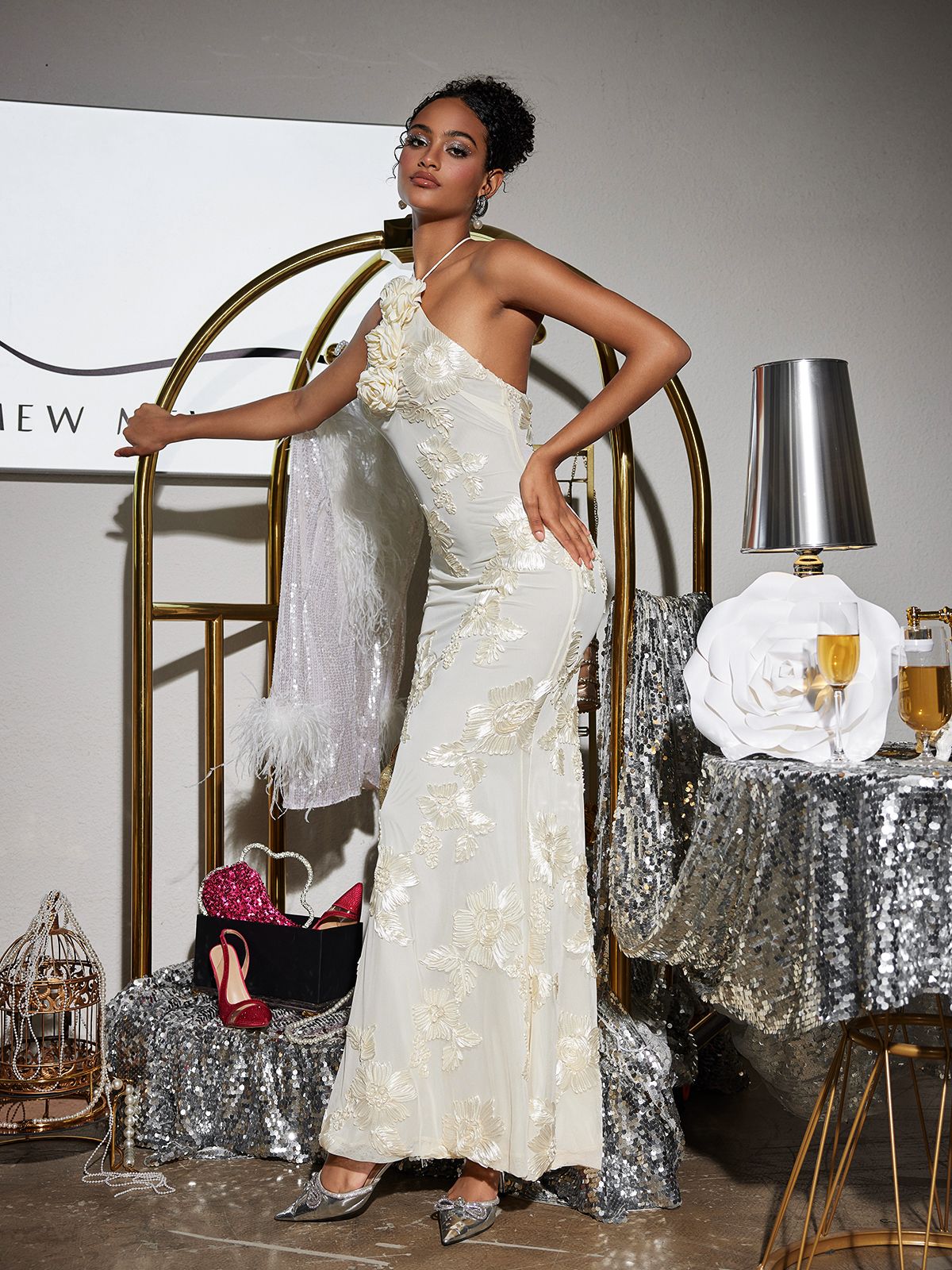 The lightweight fabric of the Aedin Halterneck Flower Maxi Dress flows beautifully in a summer breeze.