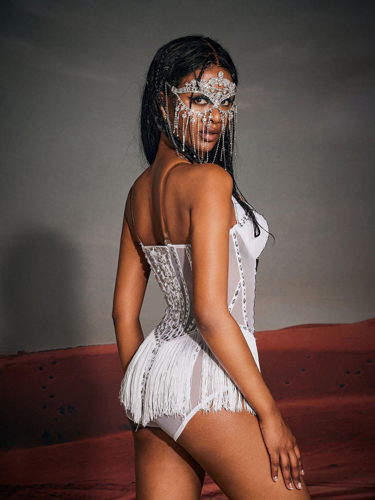 Amiri Strapless Rhinestone Fringe Bodysuit in white featuring stunning fringe and rhinestone detailing.