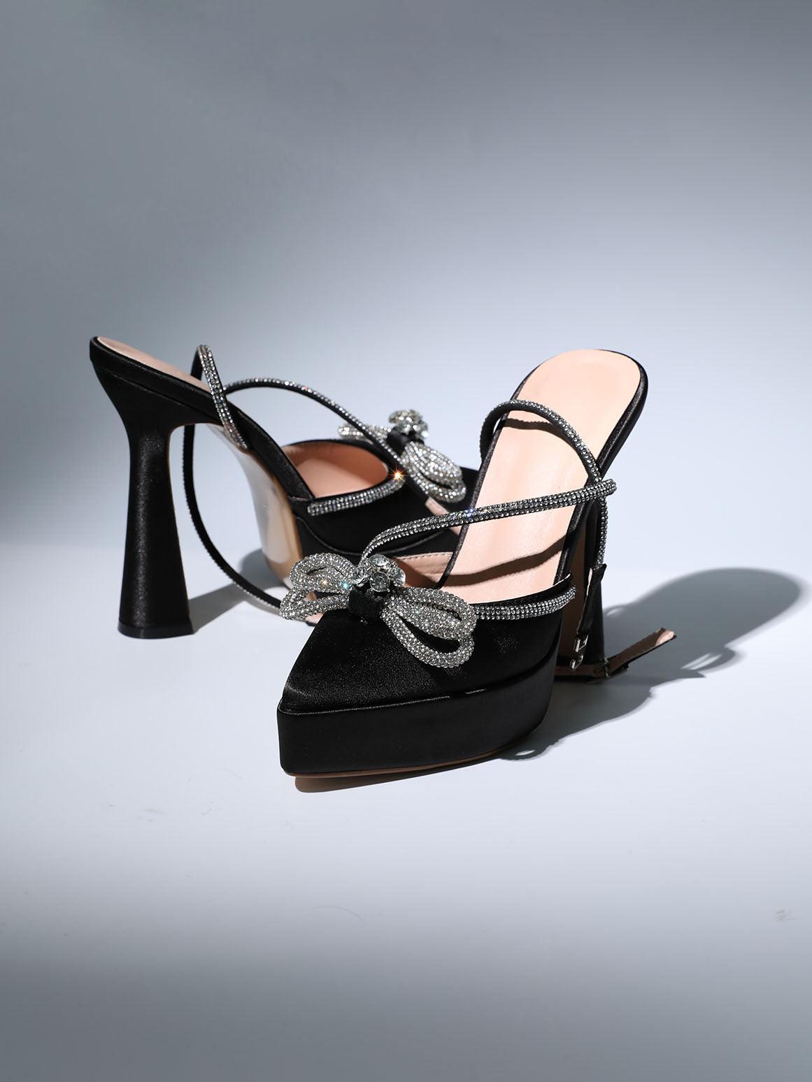 Anouk Bow Crystal Satin Heels in Black featuring elegant ankle strap and crystal embellishments.