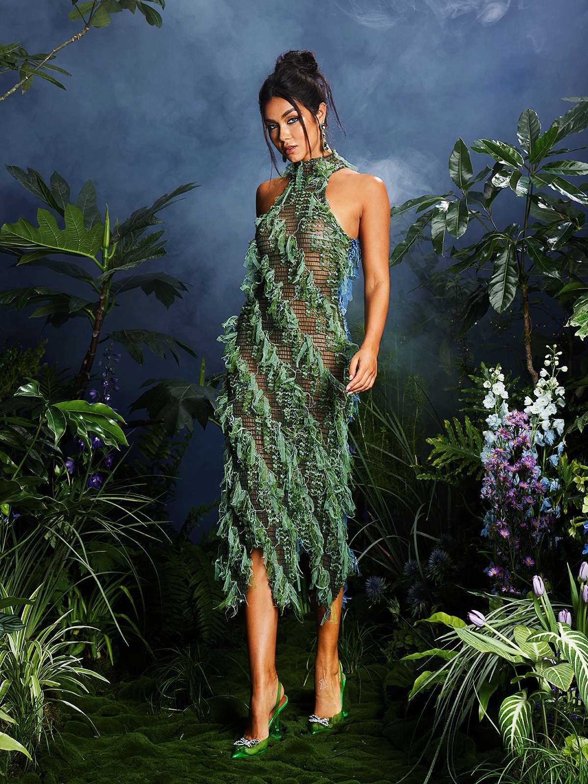 The Arlo Halterneck Backless Midi Dress in Green displayed on a mannequin highlighting its elegance.