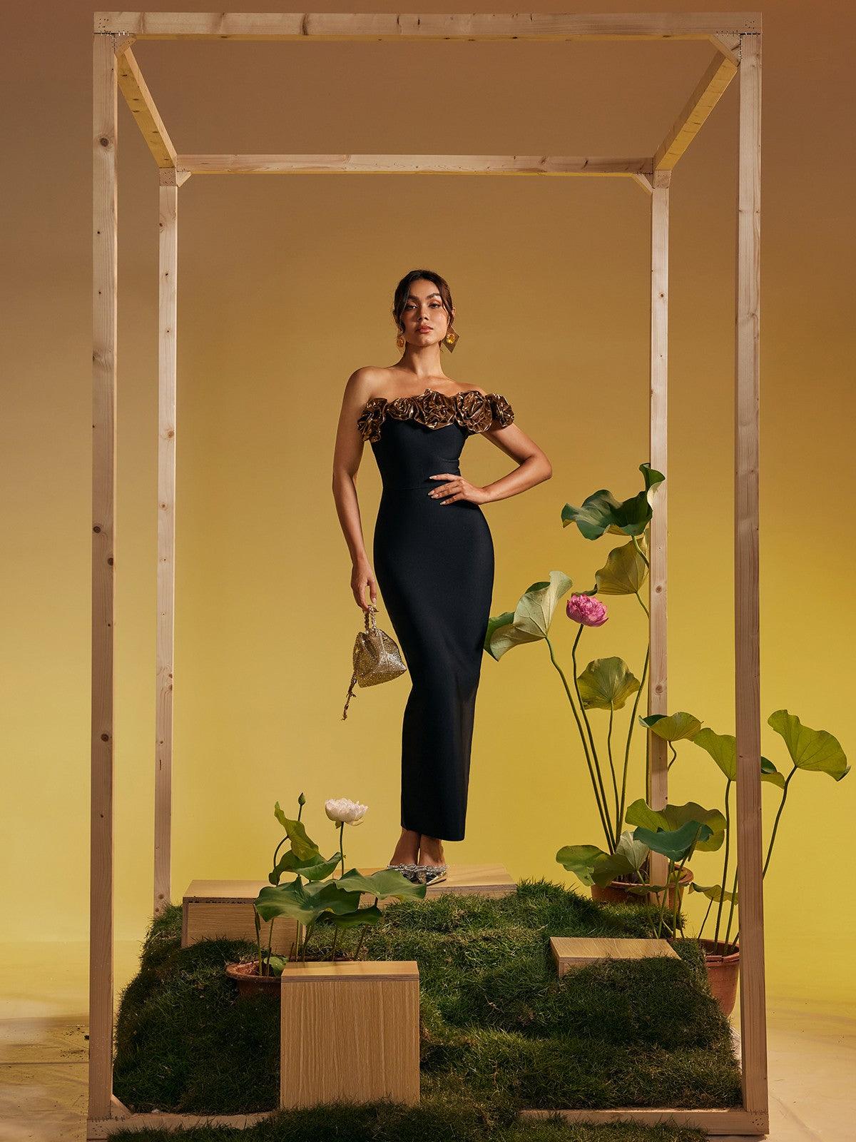 Model wearing the Arnau One Shoulder Flower Bandage Maxi Dress in Gold, showcasing its flattering silhouette and luxurious fabric.