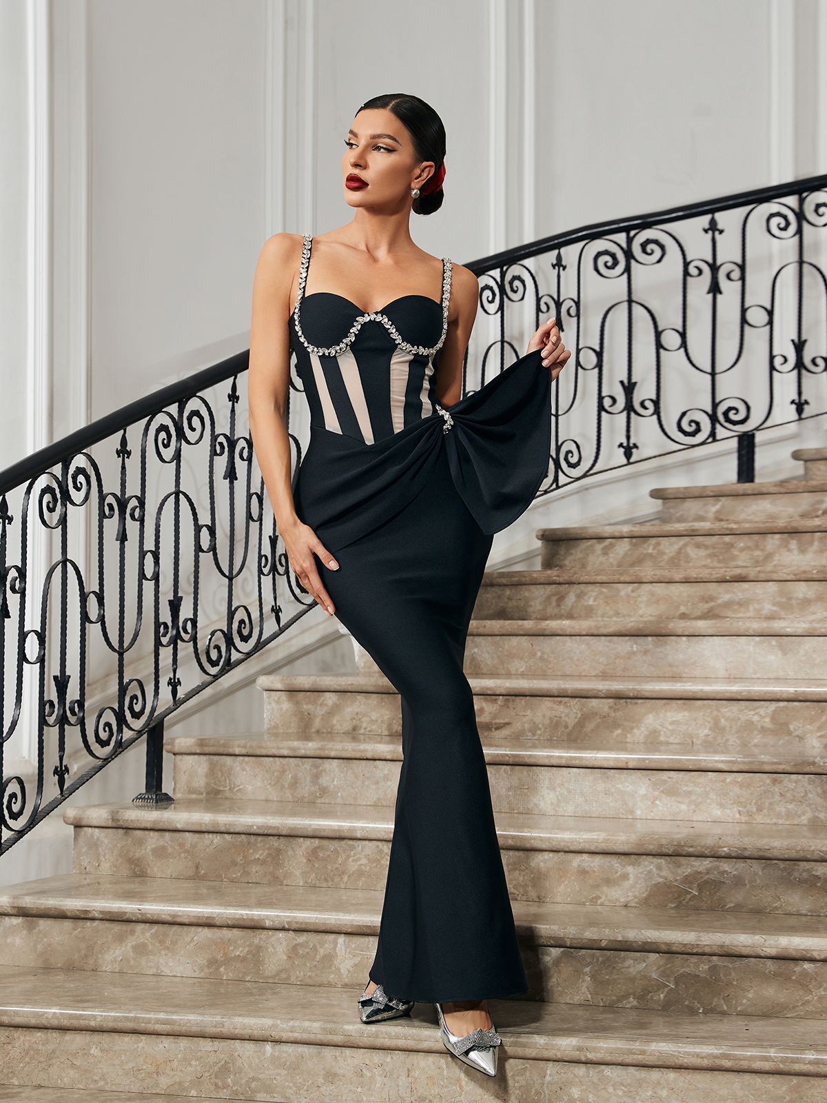 Model wearing the Aroa Crystal Mermaid Bandage Dress, highlighting its flattering fit and stylish spaghetti straps.