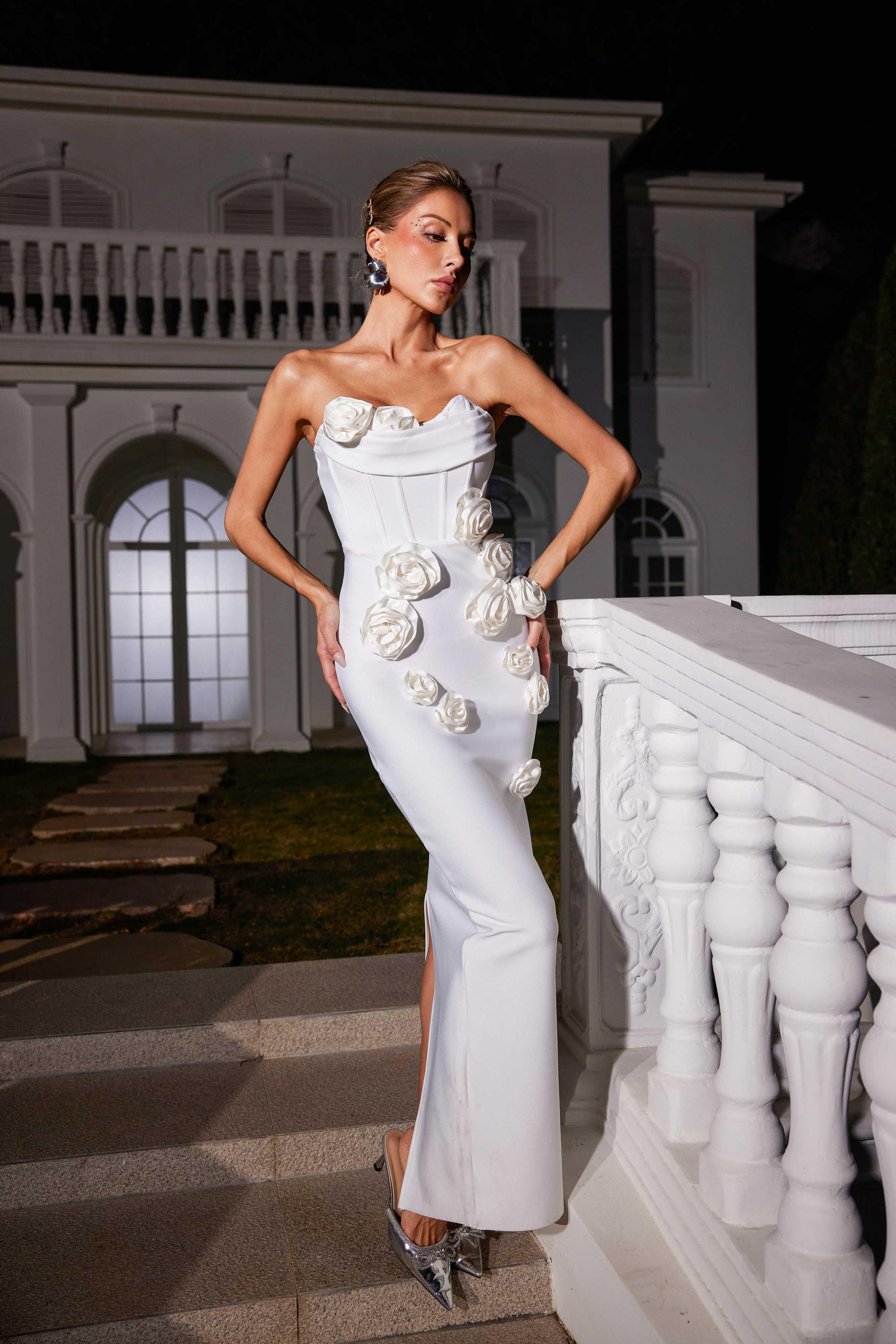 Arushi Strapless Flower Bandage Dress in white, showcasing elegant flower patterns and a curve-flattering design for evening wear.
