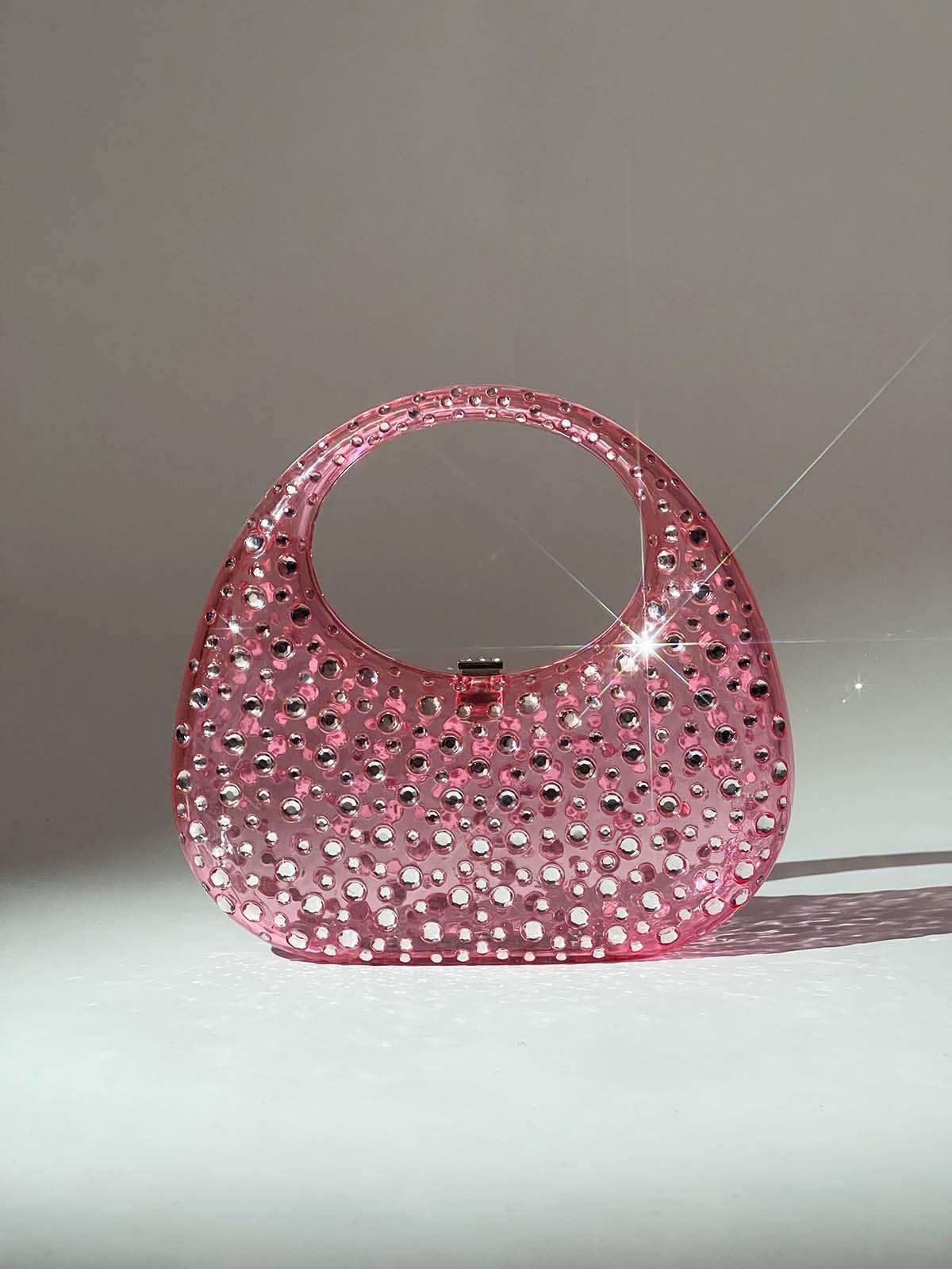 Close-up of the Asher Clear Embellished Bag's intricate embellishments, highlighting its unique design and craftsmanship.