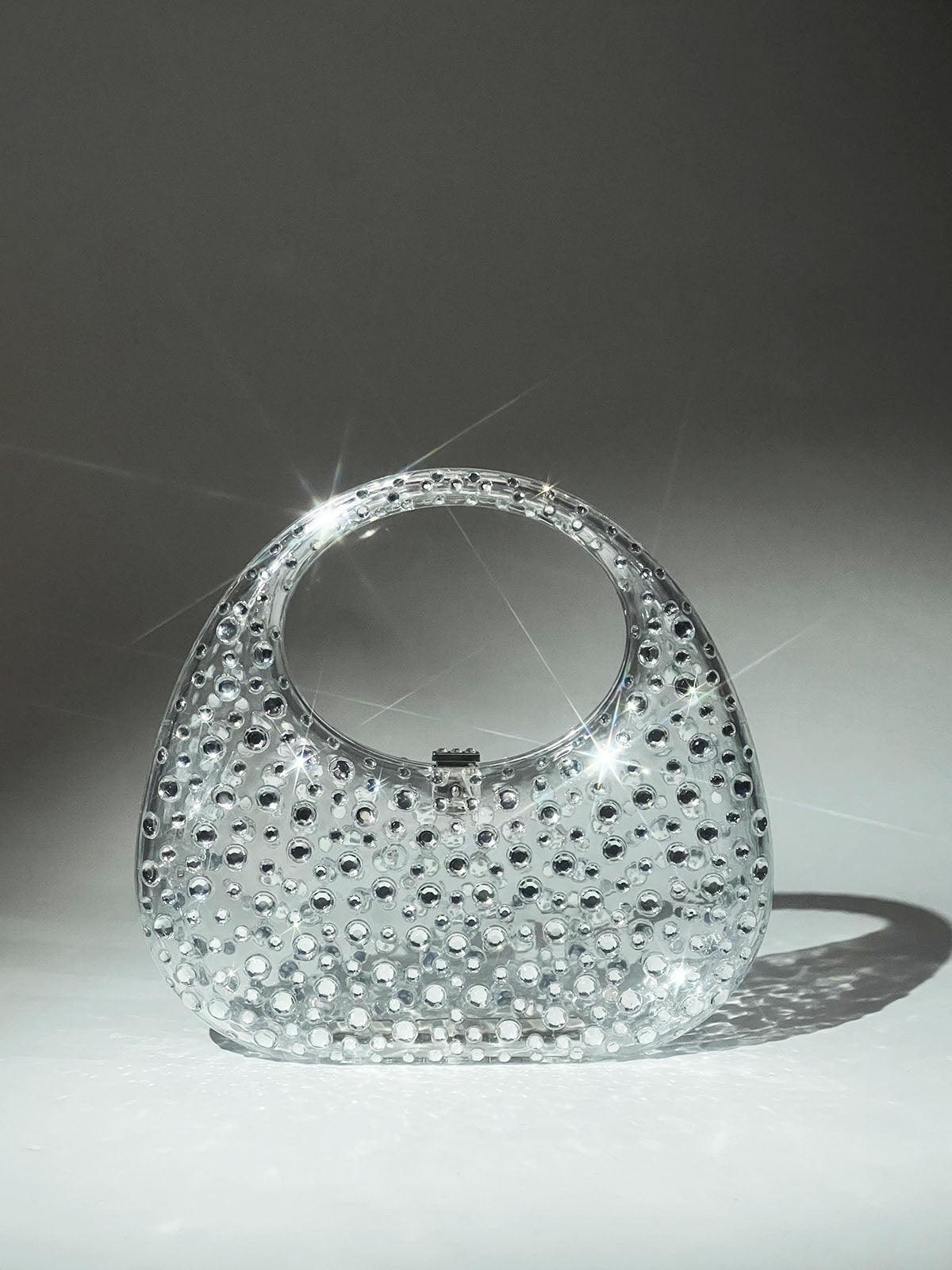 Close-up of the Asher Clear Embellished Bag showcasing intricate details and elegant embellishments.