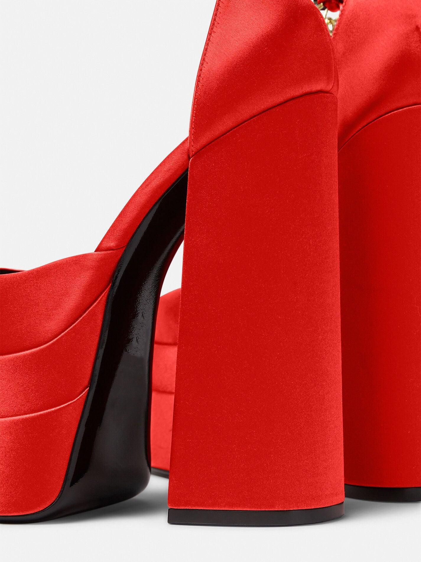 Aspen Satin Platform Pumps in Red featuring rhinestone details and adjustable ankle strap, perfect for statement footwear.