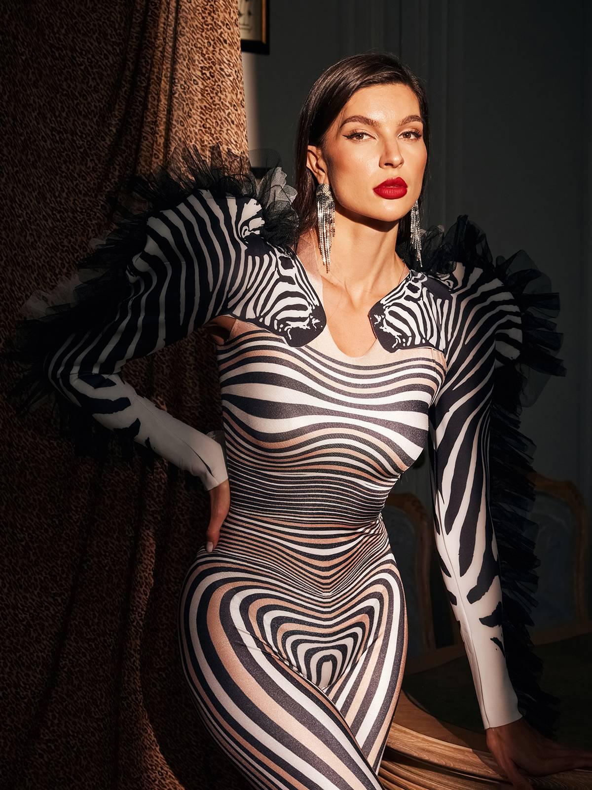 Close-up of the tulle trim detailing on the Assisi Zebra Printed Jumpsuit, showcasing its high-quality craftsmanship.