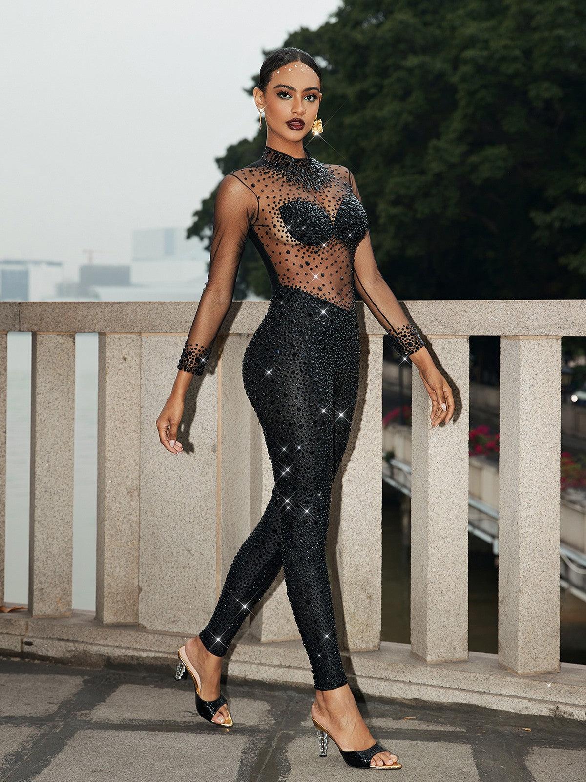 Azami Mesh Crystal Jumpsuit in Black featuring elegant crystal details and long sleeves, perfect for special occasions.