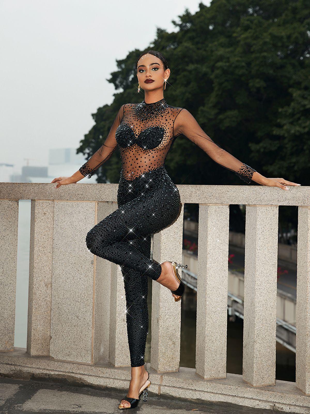 Azami Mesh Crystal Jumpsuit in Black featuring elegant crystal details and long sleeves, perfect for special occasions.