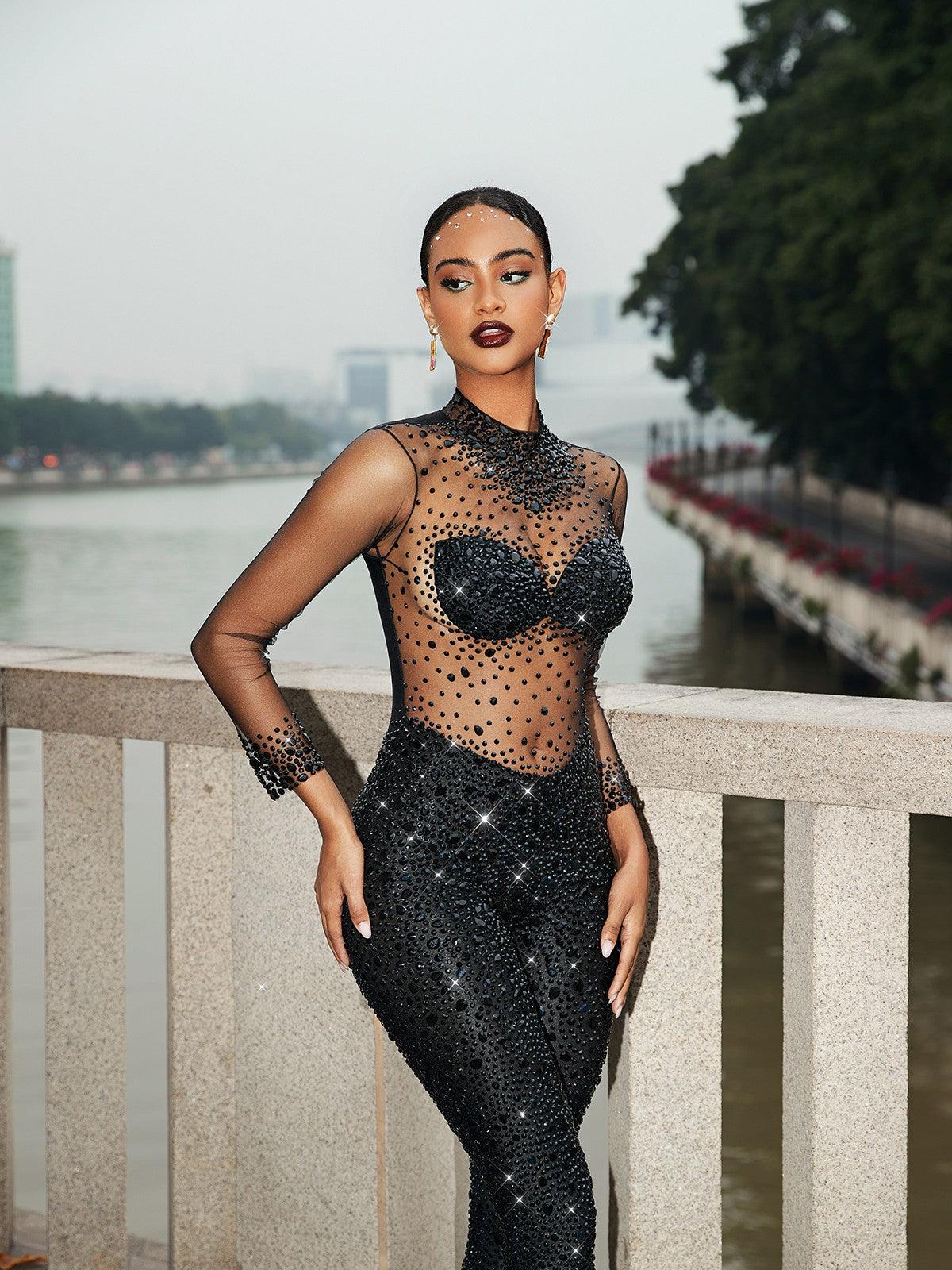 Azami Mesh Crystal Jumpsuit in Black featuring elegant crystal details and long sleeves, perfect for special occasions.