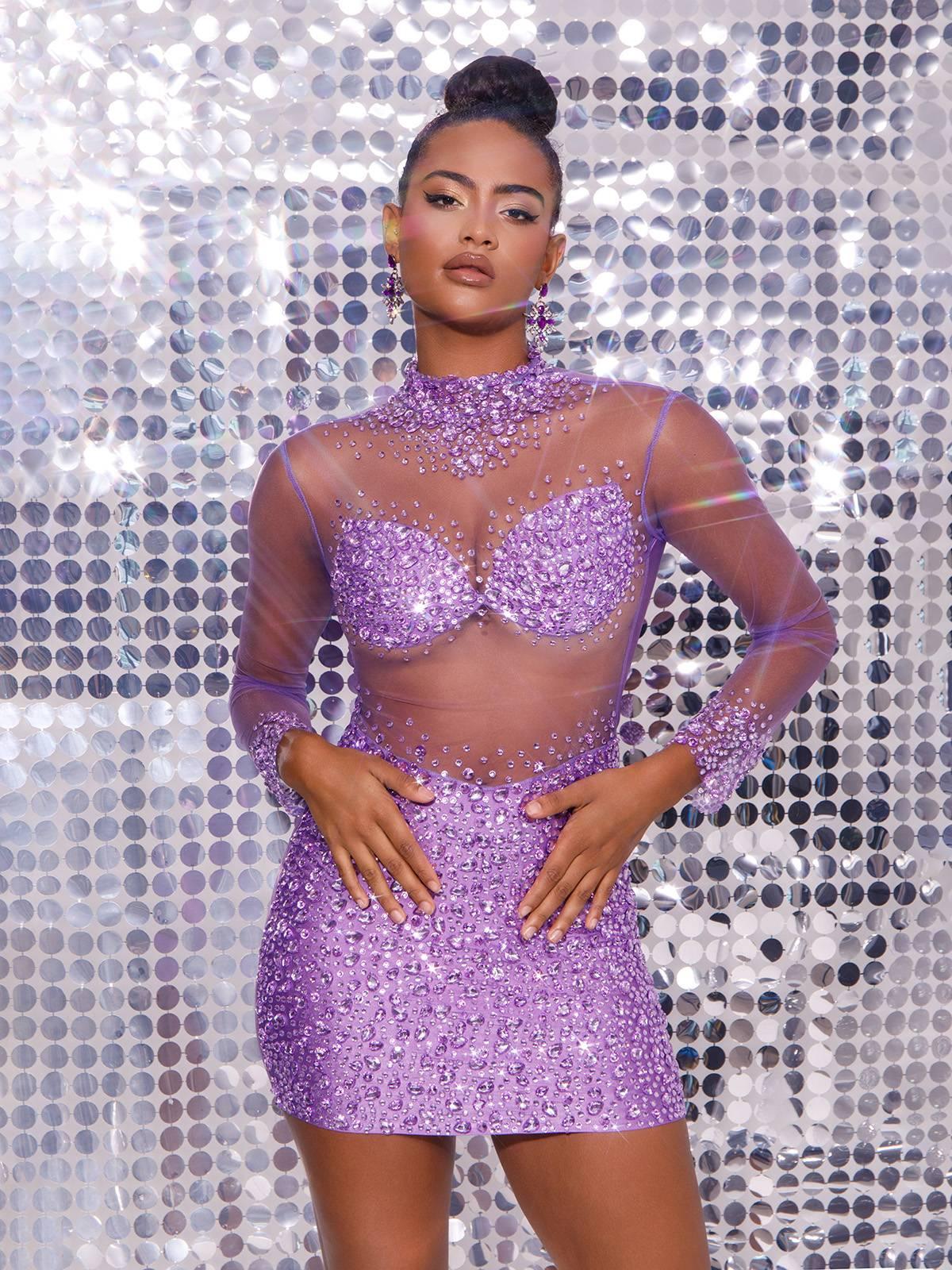 Detailed view of the Azami Mesh Crystal Mini Dress showcasing its luxurious mesh overlay and sparkling crystal embellishments.