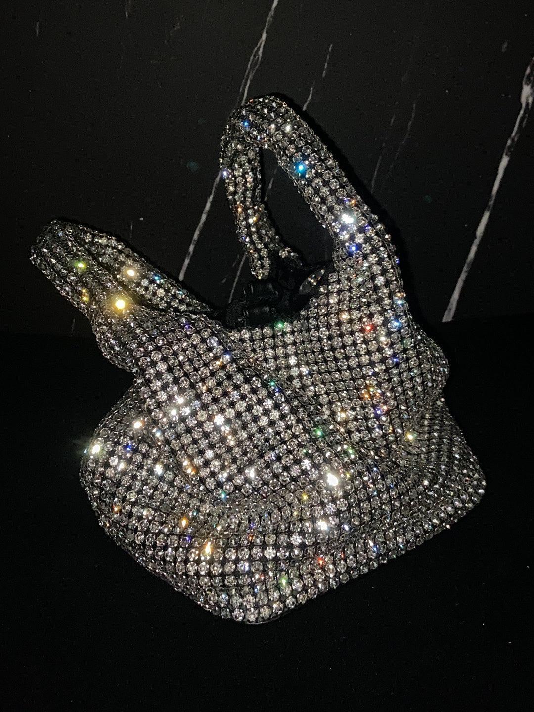 Close-up view of the Bellatrix Crystal Bucket Bag showing its intricate rhinestone detailing and elegant design.