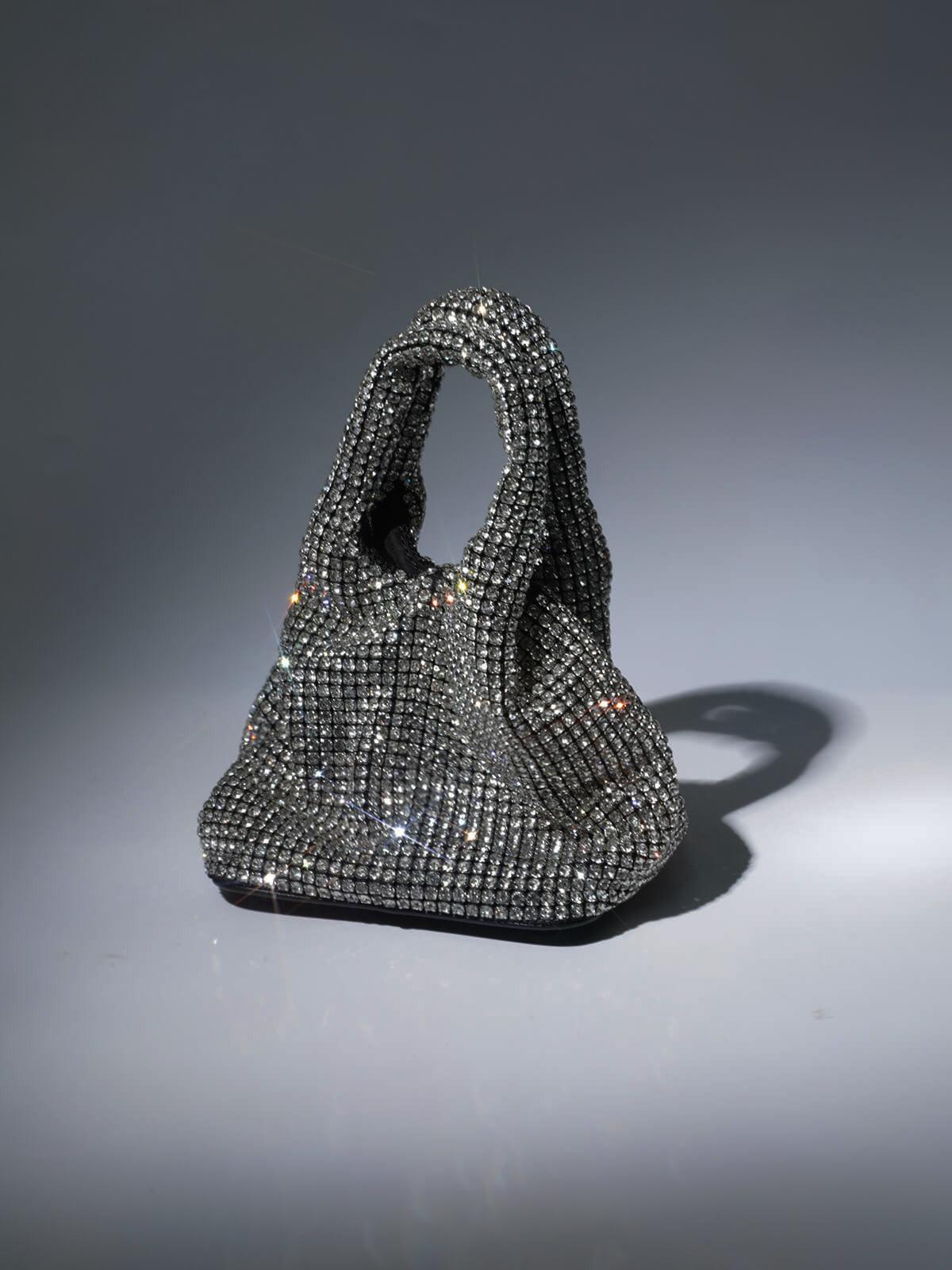 Bellatrix Crystal Bucket Bag in Silver adorned with shimmering rhinestones, perfect for chic outings.
