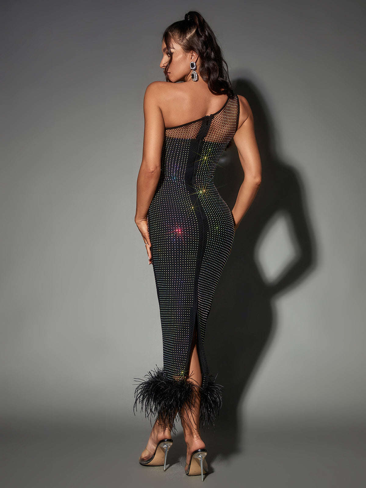 Stylish flat lay of the Bowie Mesh Diamond Feather Bandage Dress with matching accessories for a complete look.