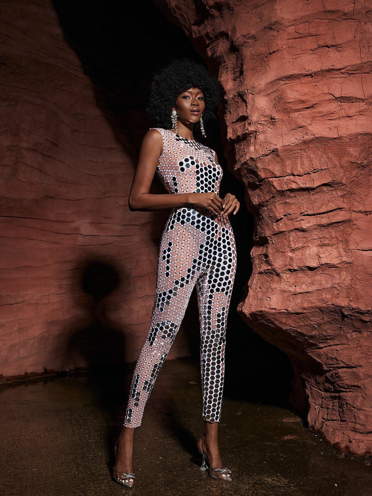 Model showcasing the Brecken sleeveless jumpsuit at a festival, exuding confidence and style.