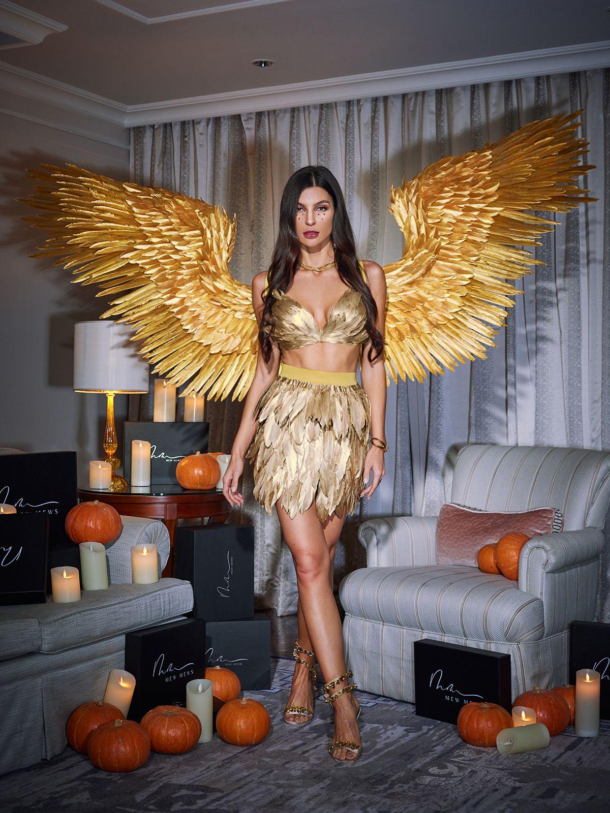 Stunning Brynhildr gold angel feather wings, a luxurious accessory for any elegant outfit.