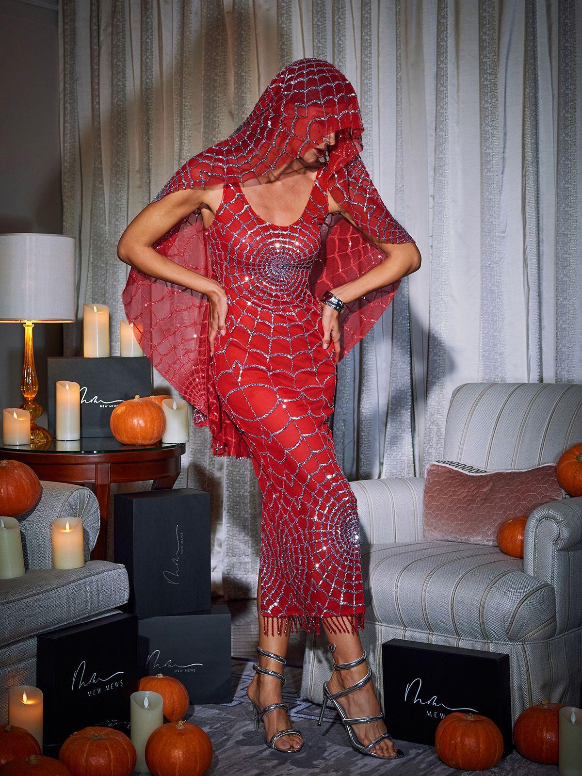 Model showcasing the Calyx Scoop Neck Midi Dress in Red at a party, illustrating its stylish evening wear appeal.