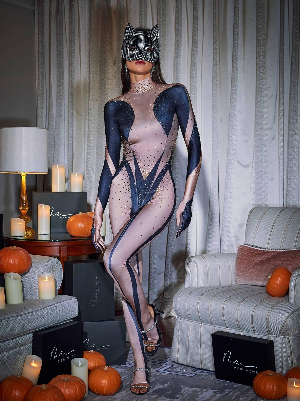 Carmelo Black Rhinestone Gloves Jumpsuit showcasing elegant design and long sleeves, perfect for sophisticated occasions.