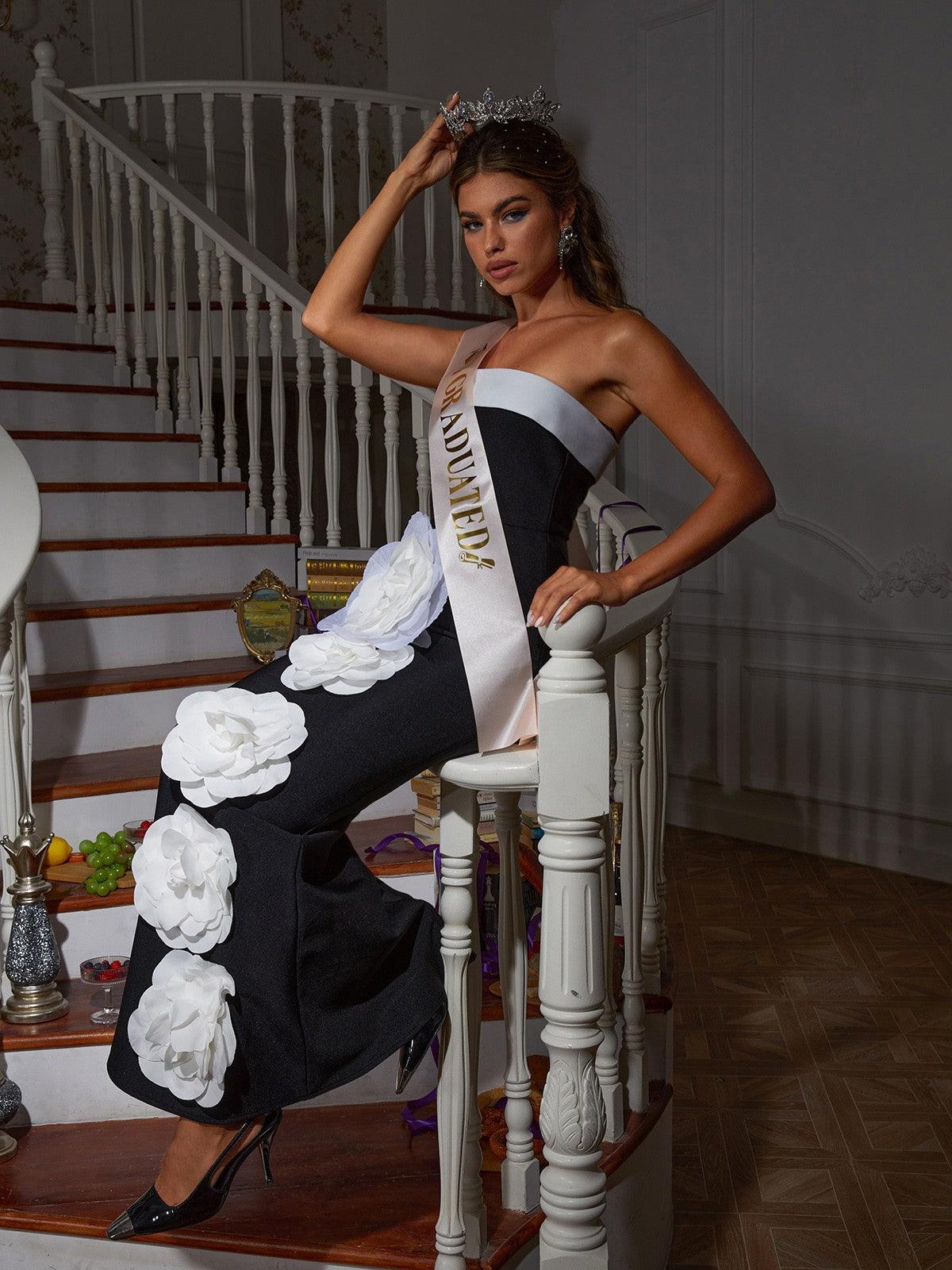 Model wearing the Carol Flower Embellished Bandage Maxi Dress at an evening event, radiating confidence and elegance.