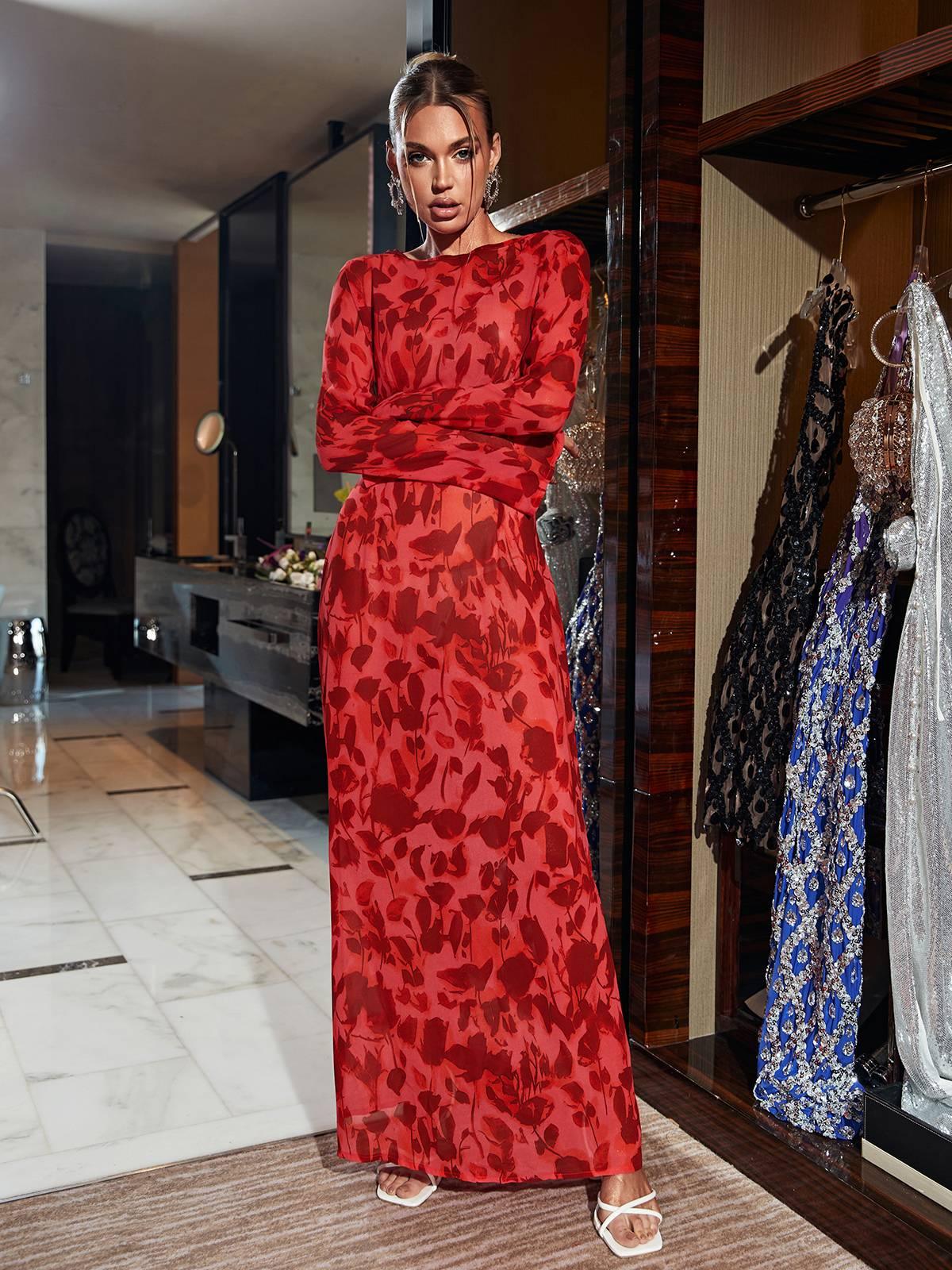 Close-up of the floral pattern on the Cecily Maxi Dress, highlighting the vibrant red hues and intricate rose prints.