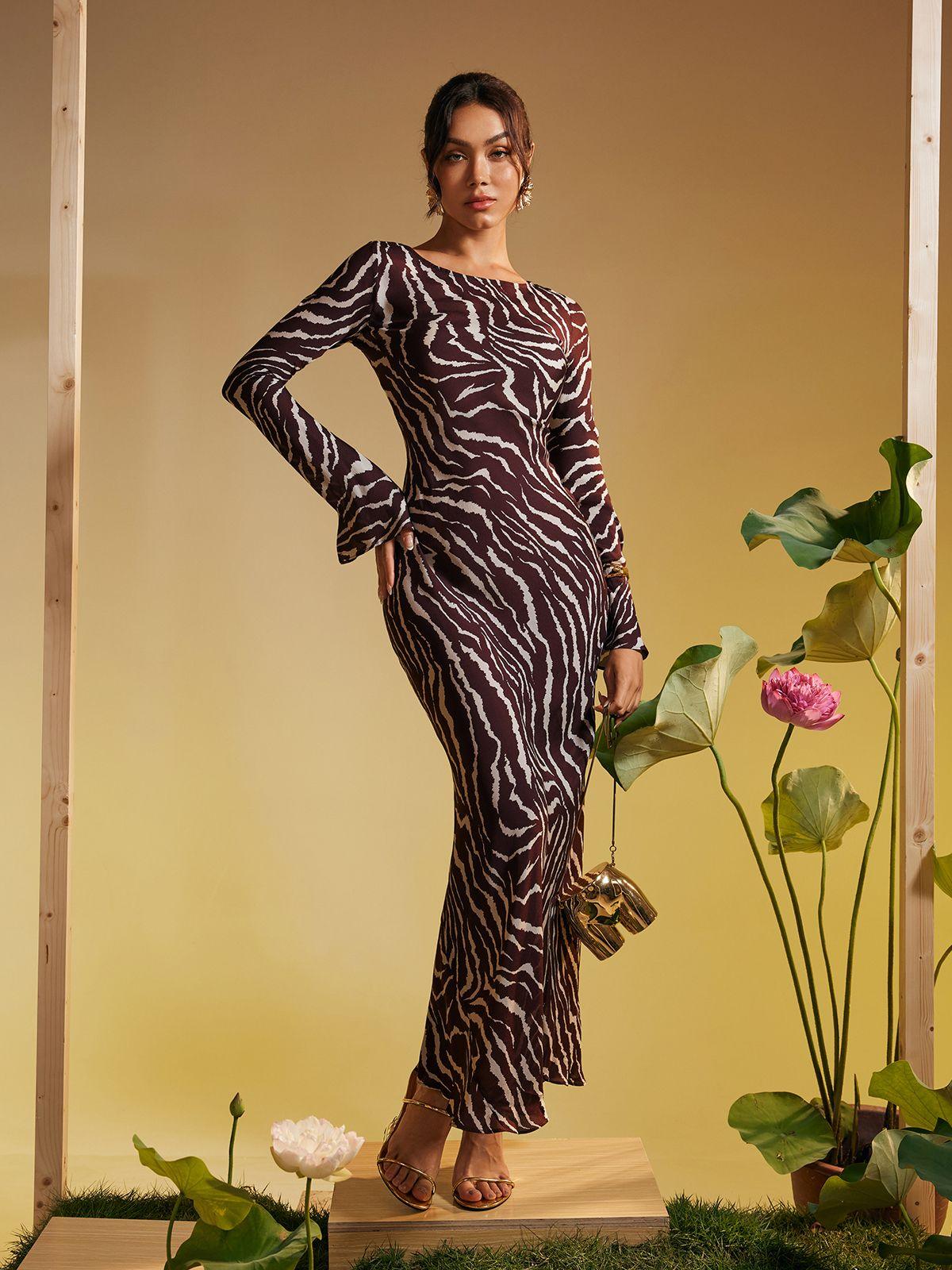 Cecily Long Sleeve Maxi Dress featuring a stunning tiger print design in browns, perfect for stylish occasions.
