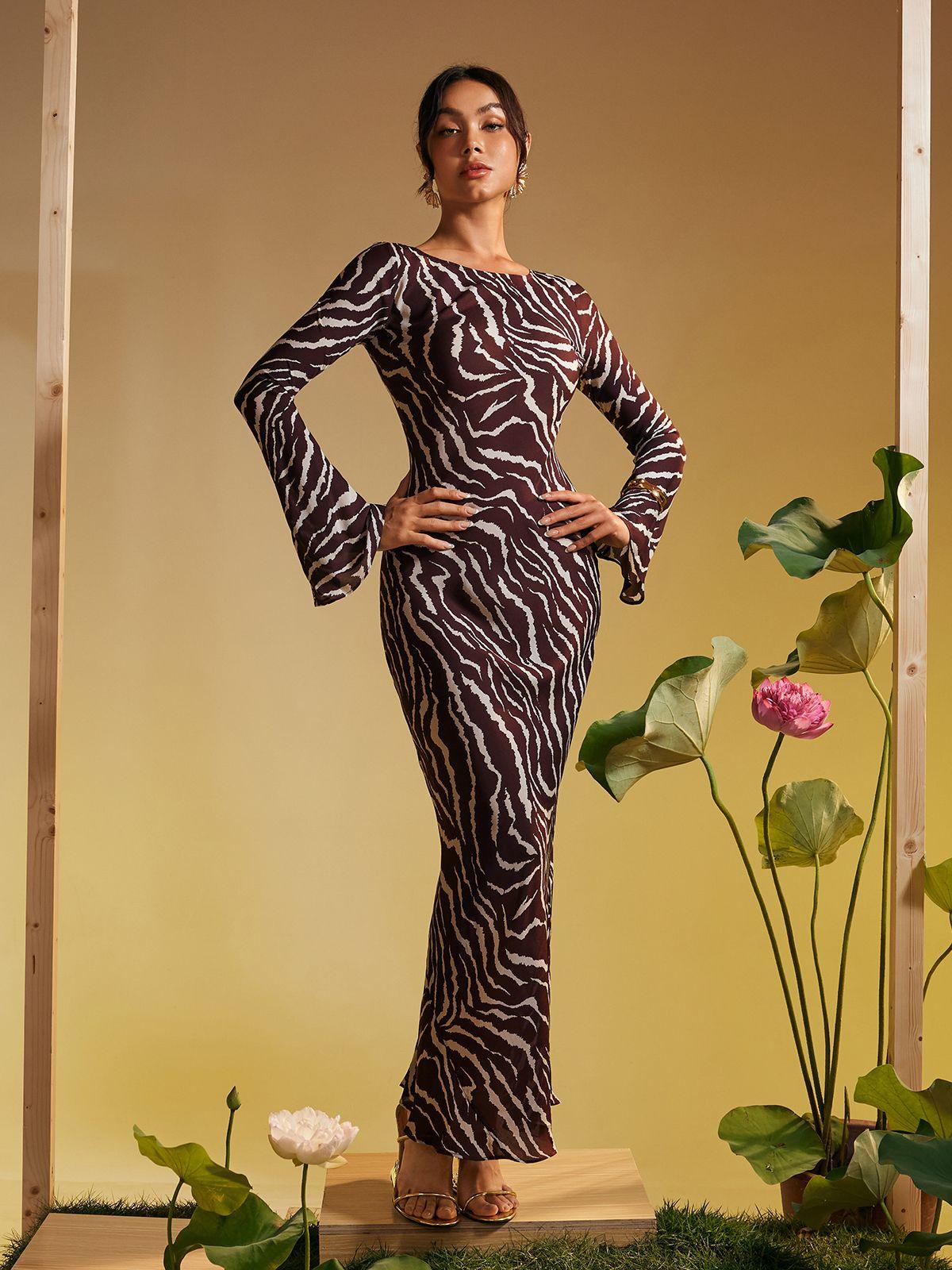 Cecily Long Sleeve Maxi Dress featuring a stunning tiger print design in browns, perfect for stylish occasions.