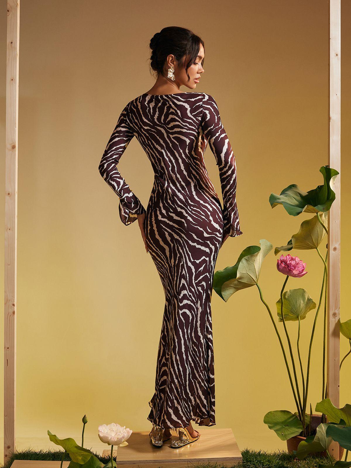 Back view of the Cecily Maxi Dress, showcasing its elegant long sleeve design.