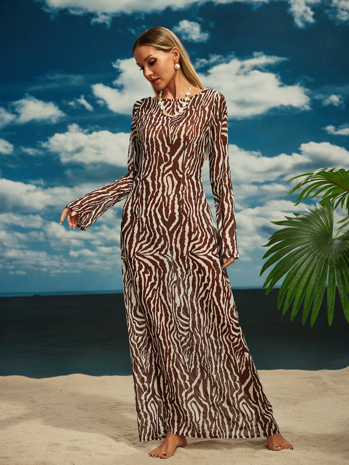 Flat lay of the Cecily Tiger Print Maxi Dress with matching accessories for styling.