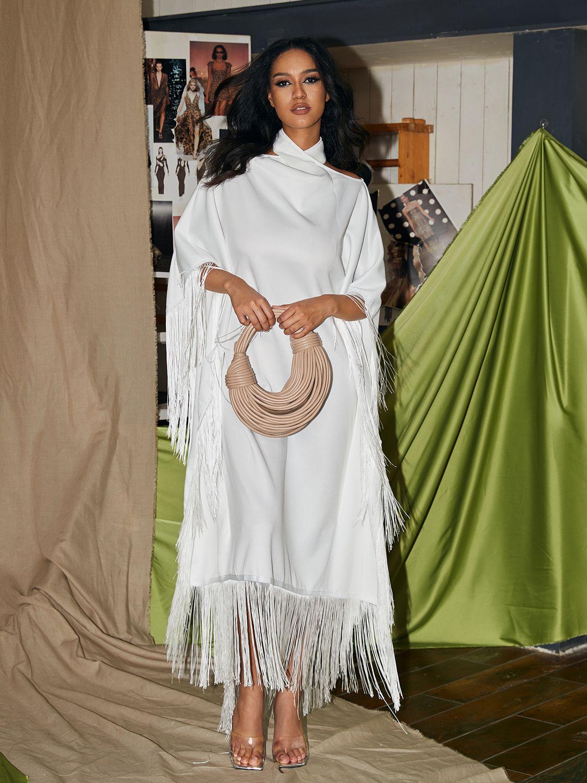 Ceridwen Cricross Fringe Kaftan Dress in white, showcasing a stylish halter neck and fringe details, ideal for cocktail parties.