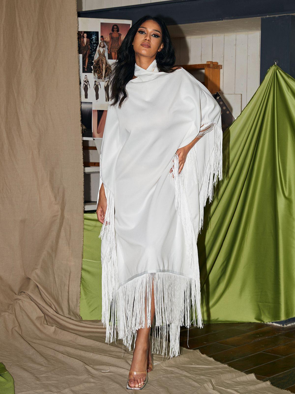 Ceridwen Cricross Fringe Kaftan Dress in white, showcasing a stylish halter neck and fringe details, ideal for cocktail parties.