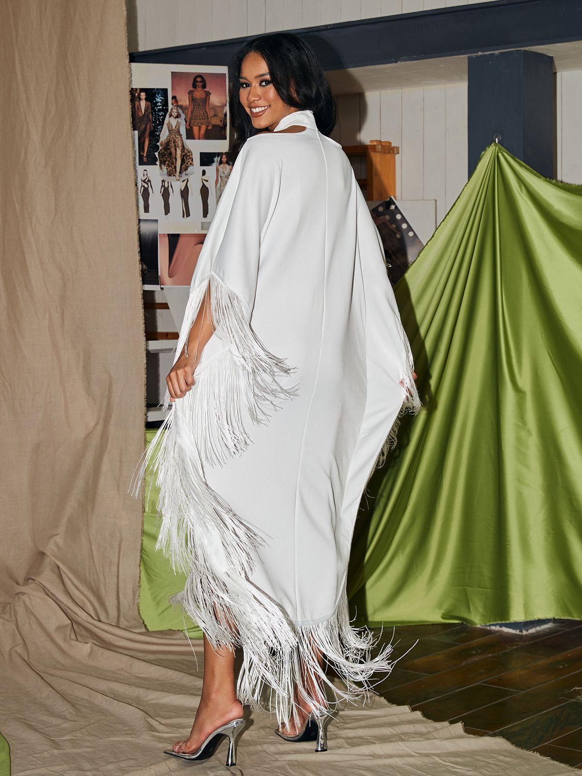 Ceridwen Cricross Fringe Kaftan Dress in white, showcasing a stylish halter neck and fringe details, ideal for cocktail parties.