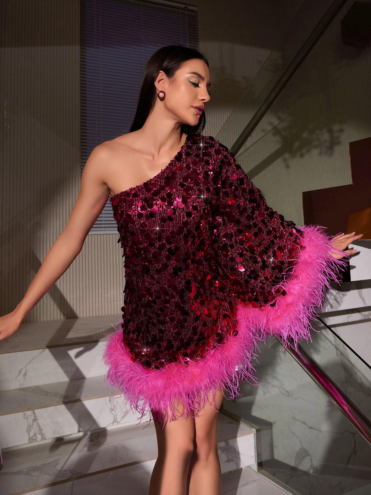 Close-up of the feather detailing on the Ceridwen One Shoulder Dress, highlighting the luxurious sequin embellishments.