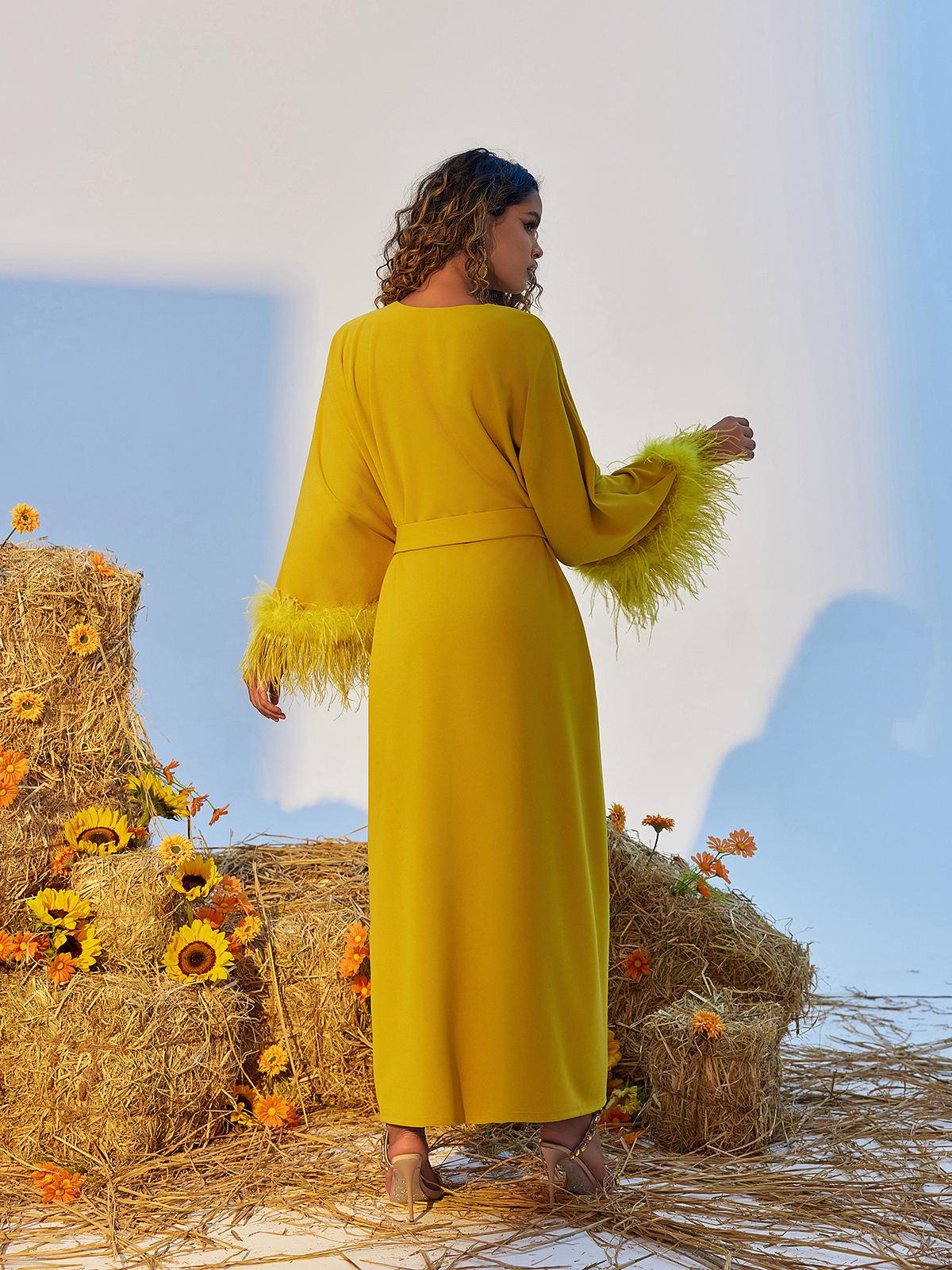 Ceridwen V Neck Feather Trimmed Split Maxi Dress in yellow, showcasing elegant design and graceful silhouette.