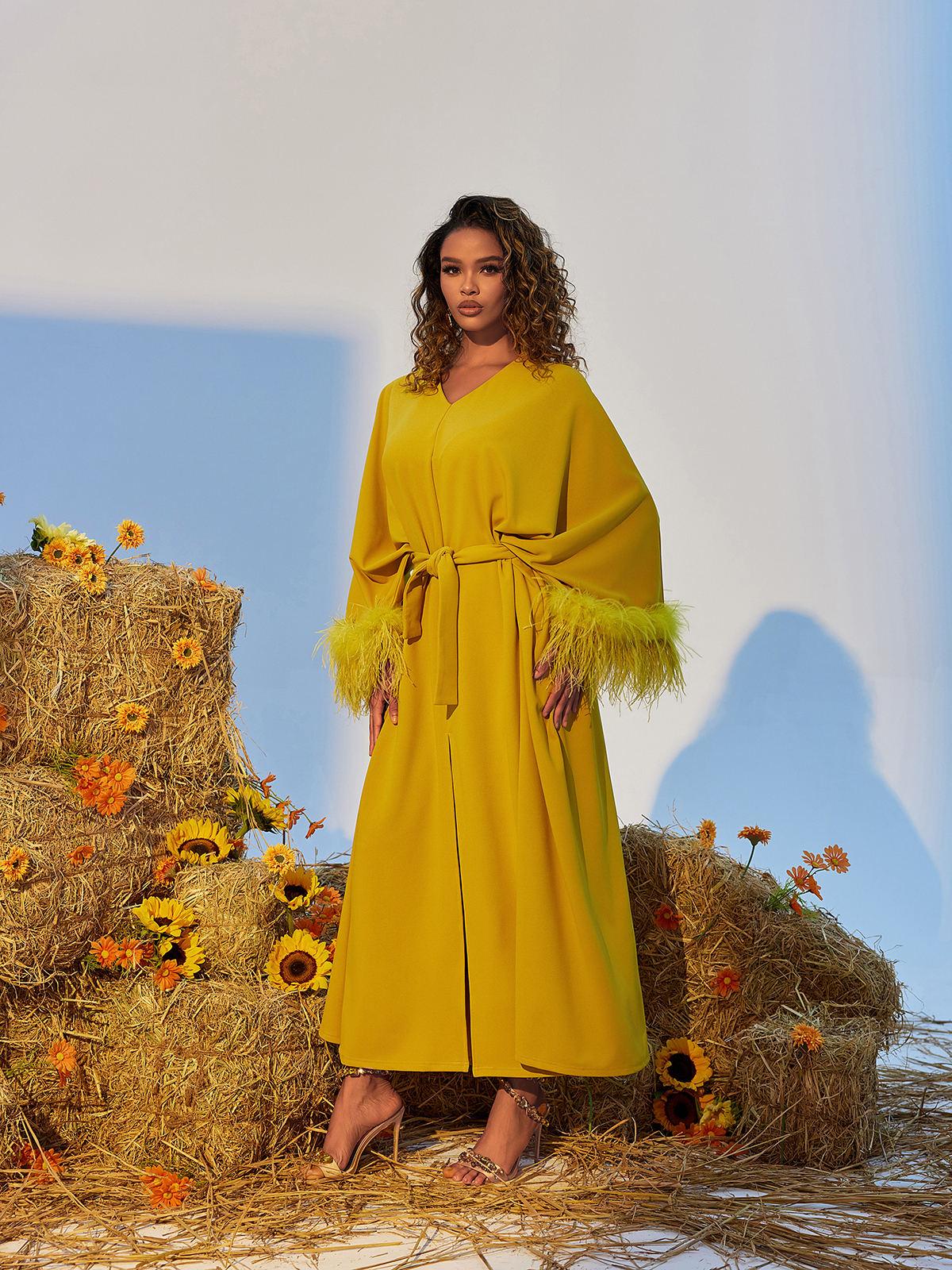 Model wearing the Ceridwen V Neck Maxi Dress, showcasing its graceful silhouette and perfect fit for any event.