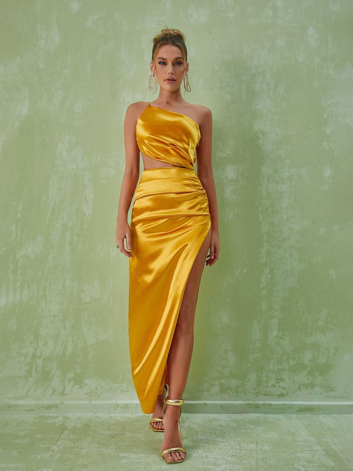 Close-up of the ruched waist detail on the gold one shoulder maxi dress, highlighting its elegant design.