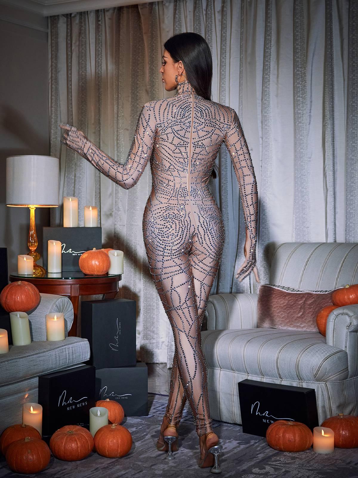 Chimera Cobweb Rhinestone Jumpsuit in nude featuring stunning rhinestone details and a chic cobweb design.