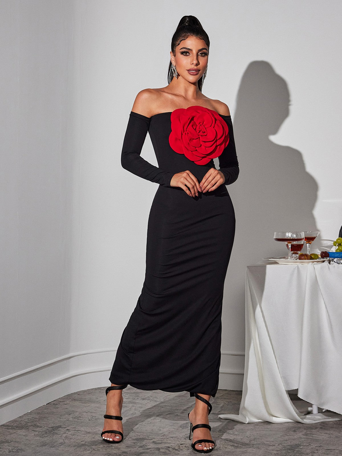 Close-up of the off-shoulder neckline of the Claus Red Flower Maxi Dress, emphasizing its fashionable appeal.
