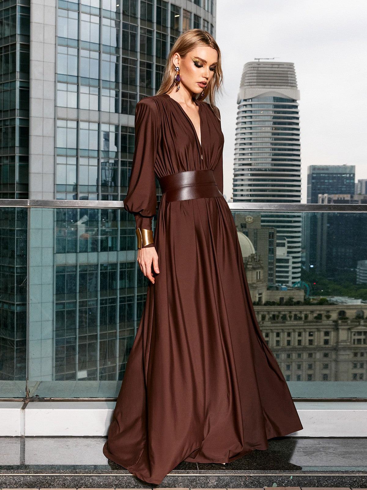 Model showcasing the Cosmo V Neck Belted Maxi Dress at a cocktail party, radiating sophistication and style.