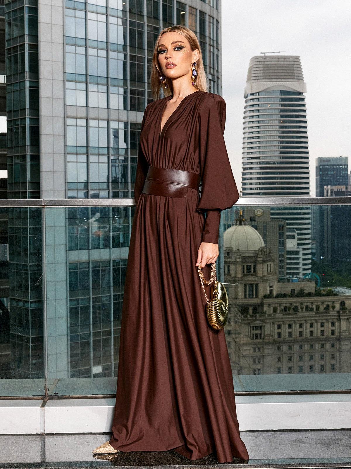 Back view of the Cosmo V Neck Belted Maxi Dress in brown, emphasizing its long sleeves and elegant silhouette.