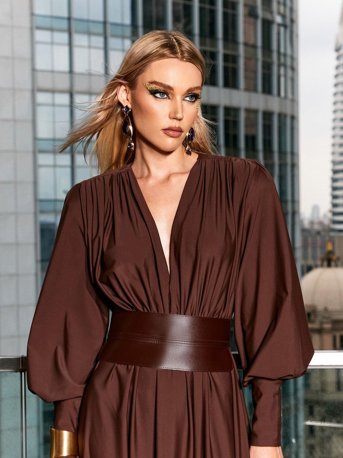 Close-up view of the belted waist detail of the Cosmo V Neck Maxi Dress, highlighting its elegant design.
