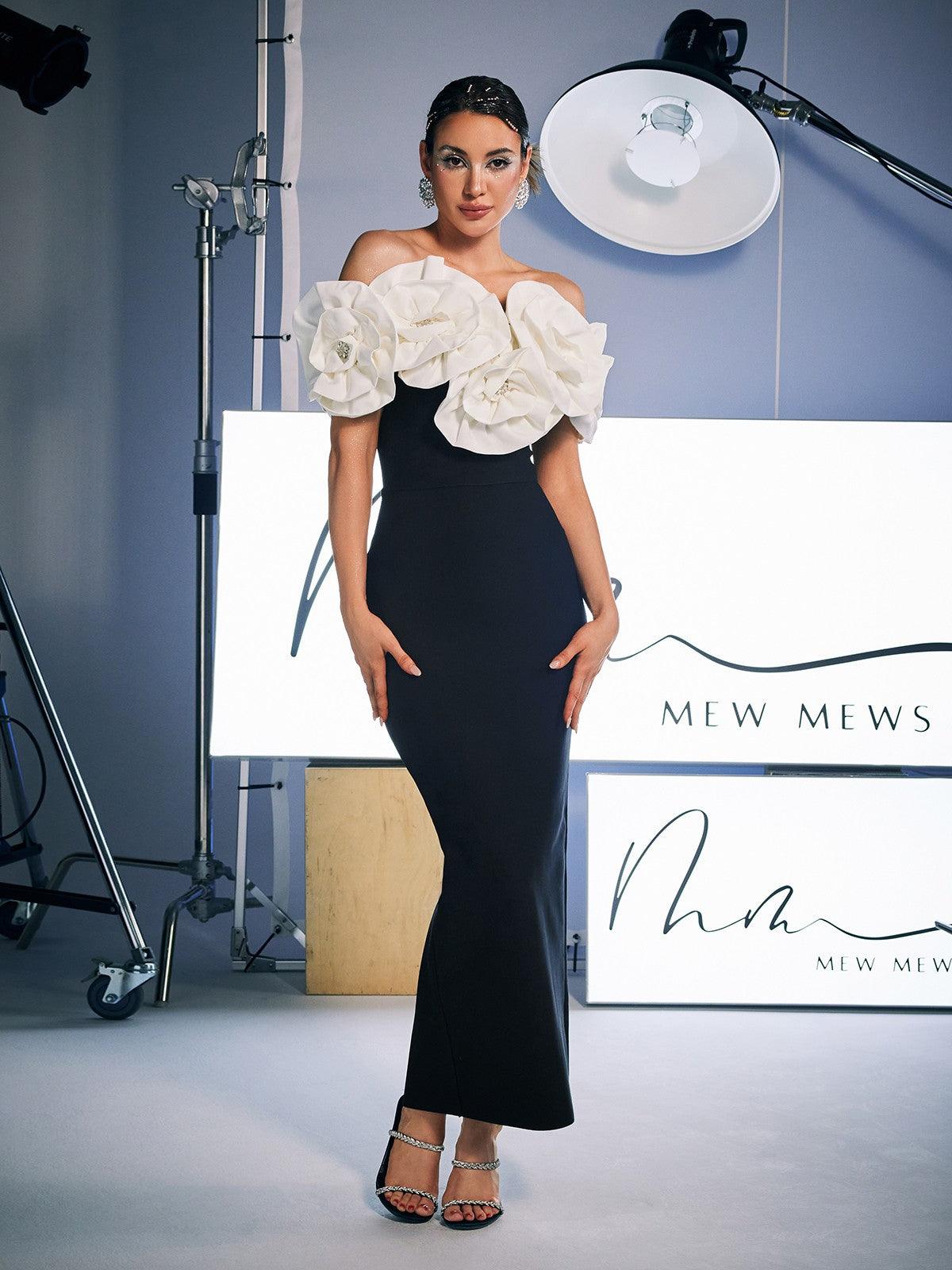 Elegant Creed Off Shoulder Flower Bandage Dress in black, featuring floral detailing and a high stretch fit.