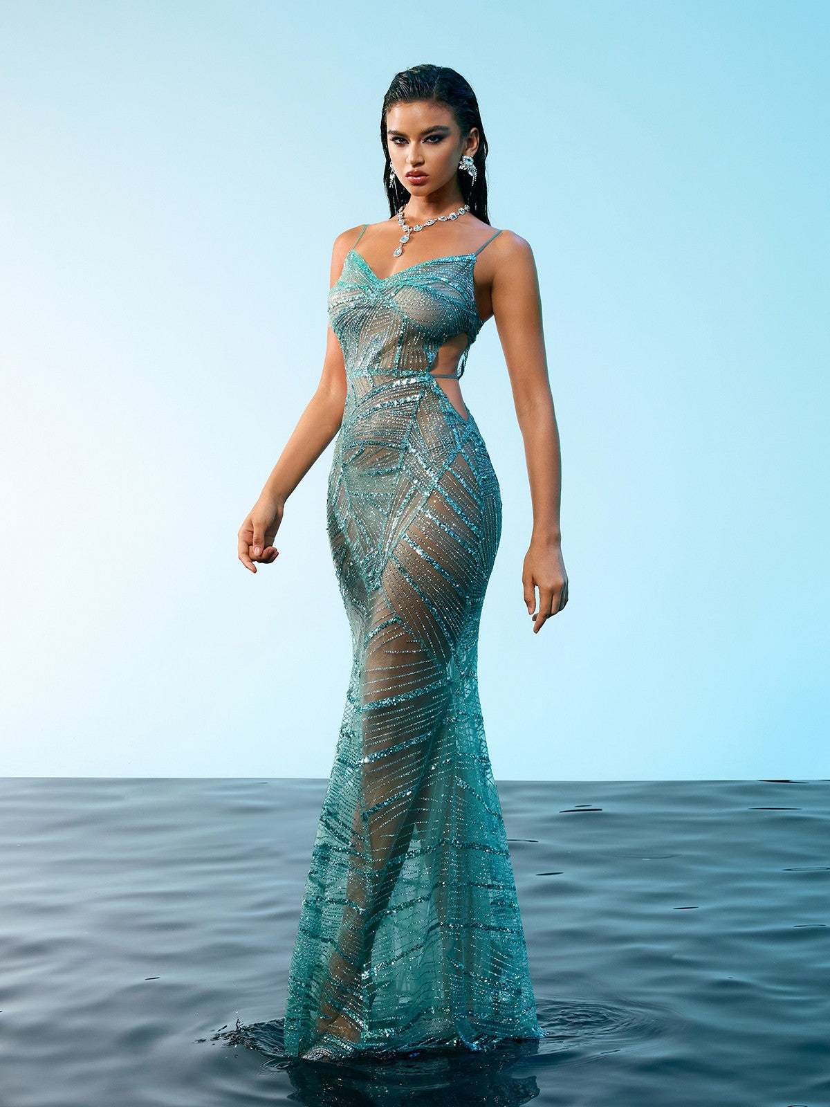 Back view of the Cynthia Spaghetti Sequin Maxi Dress, showcasing its elegant design and spaghetti strap silhouette.