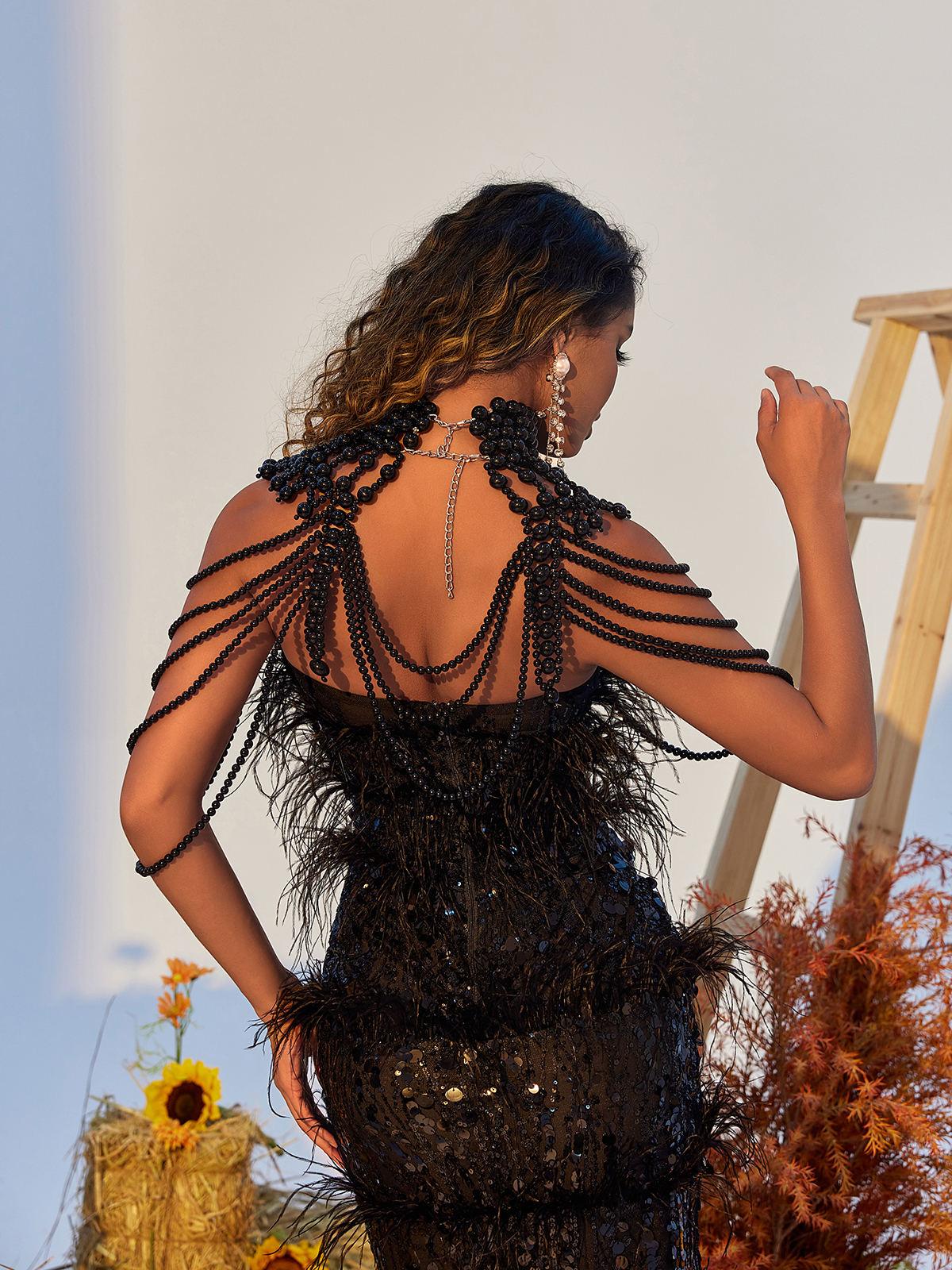 Dani Pearl Body Chain Top in Black featuring a lightweight design and elegant pearl accents, perfect for chic styling.