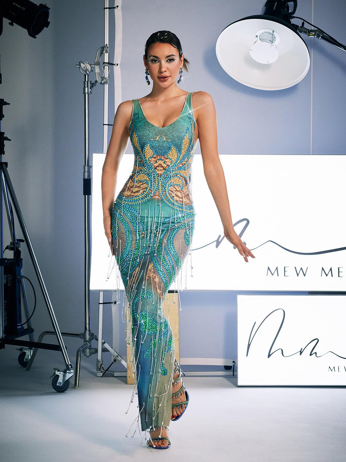 Model showcasing the Darrell Print Crystal Fringe Maxi Dress in a vibrant setting, emphasizing its comfortable style and elegant fashion.