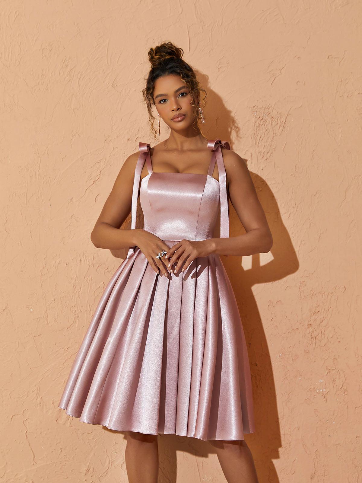 Model wearing the Deidra Satin Pleated Dress, demonstrating its flattering fit and comfortable style for cocktail events.