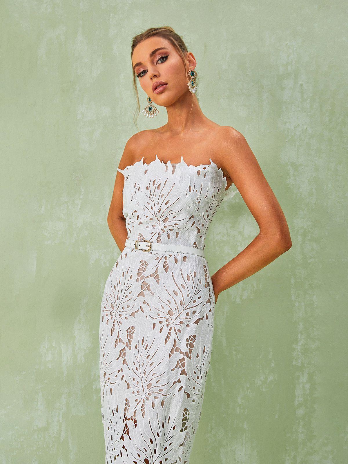 Back view of the Despina White Lace Midi Dress, emphasizing its strapless design and elegant silhouette for special occasions.