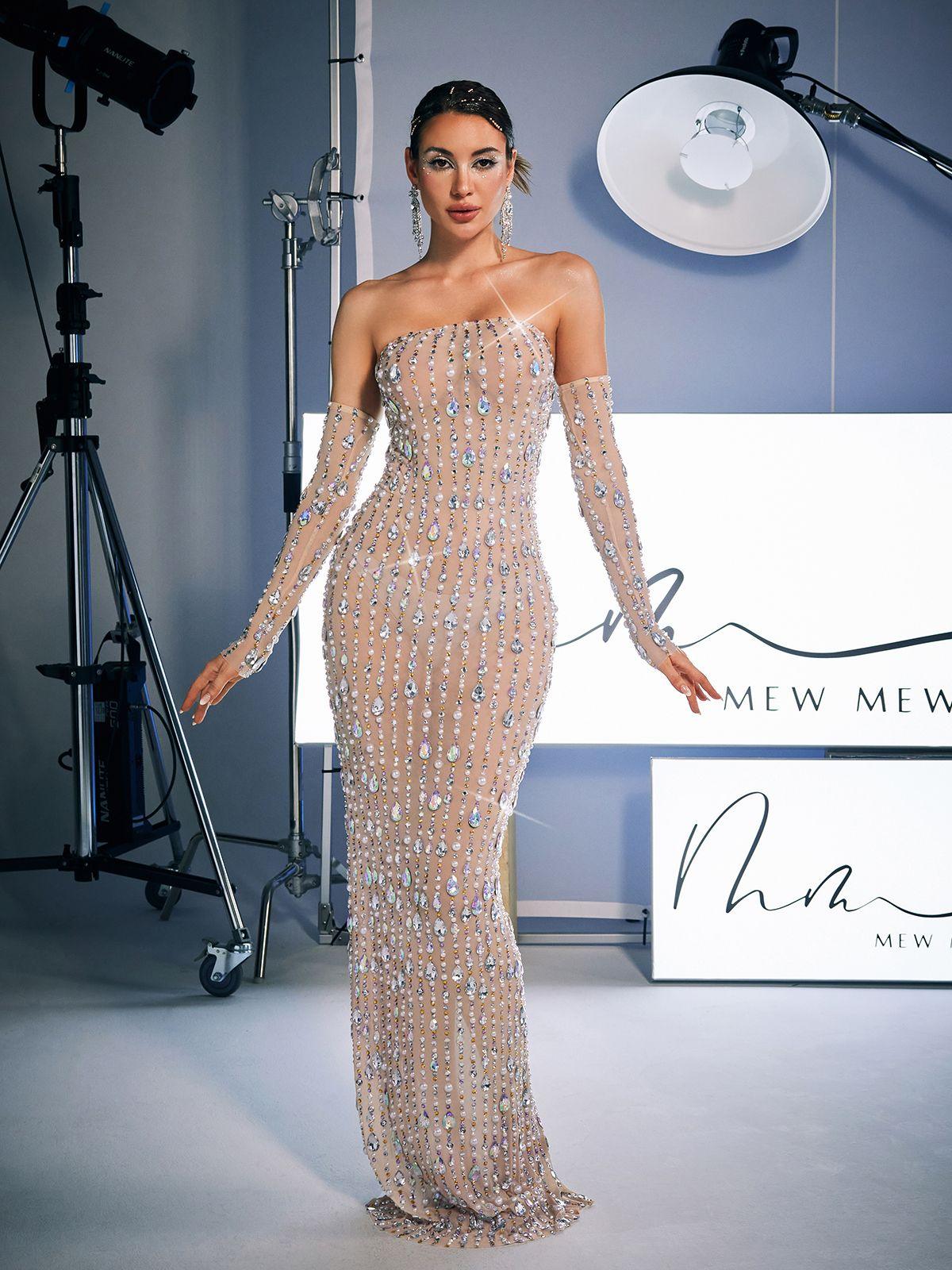Side view of the Douglas Strapless Rhinestone Maxi Dress, emphasizing the flow of the luxurious fabric.