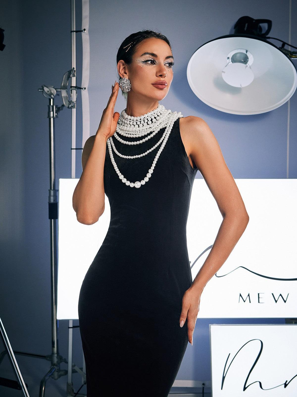 Close-up of pearl embellishments on the Dustin High Neck Maxi Dress, highlighting its luxurious and glamorous details.